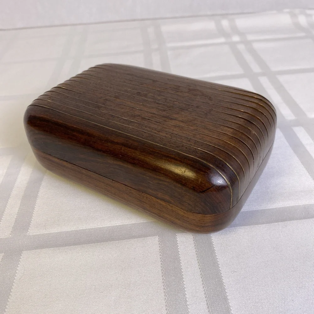 Hand carved 2 piece wood box with metal hinge, hook and metal ribs on lid